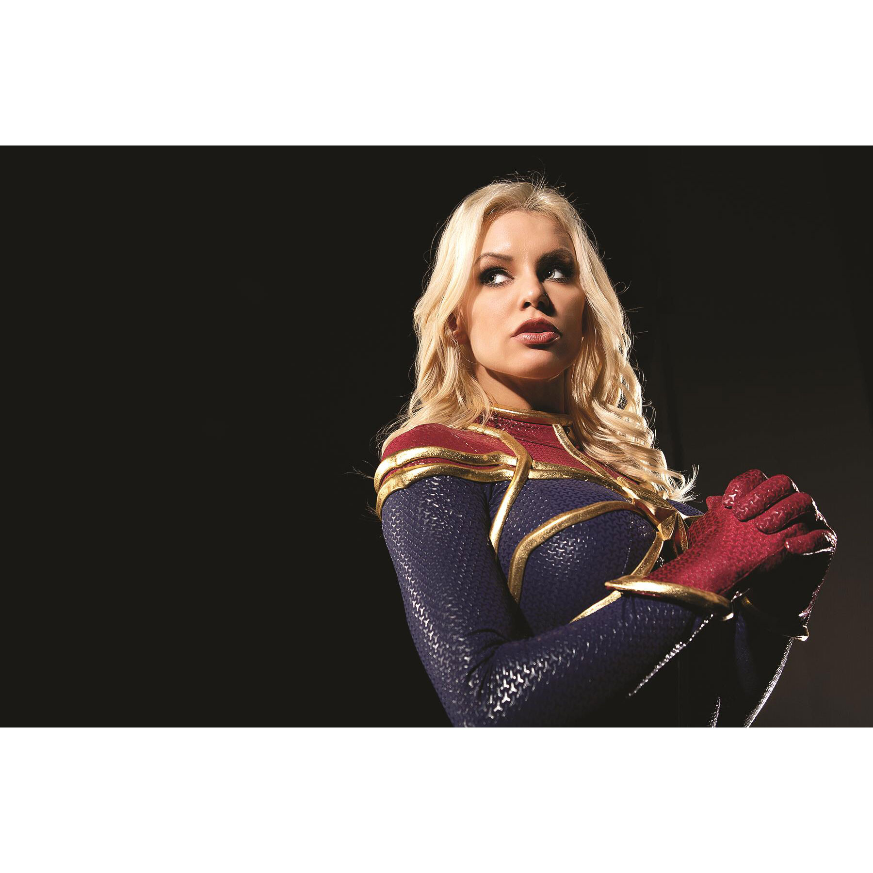 Blonde female wearing super hero costume