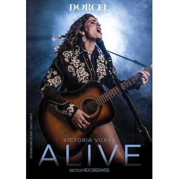 Brunette female posed playing guitar alive