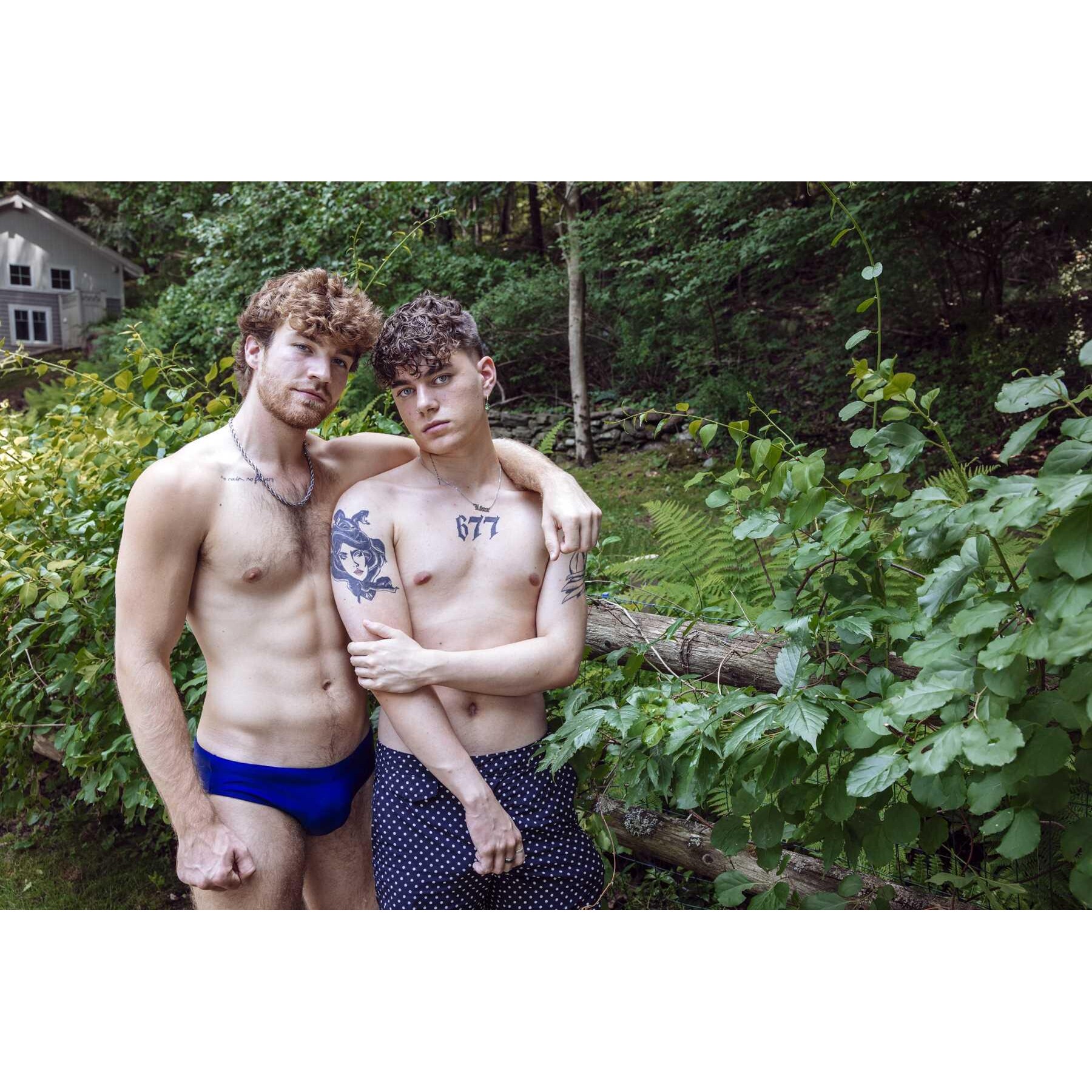 Topless males displaying abs caressing